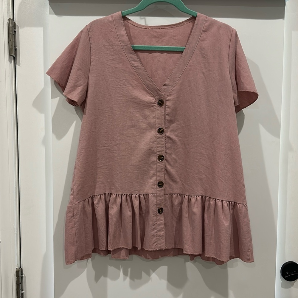 Pink peplum style top